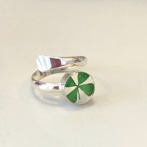 Lucky four leafed clover encased in resin and mounted on a hand crafted sterling silver band