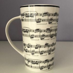 Latte coffee cup with a musical score design