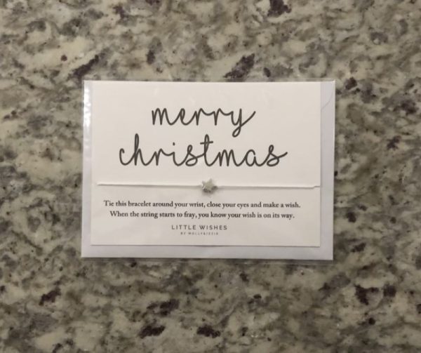 merry christmas card with a silver star charm bracelet