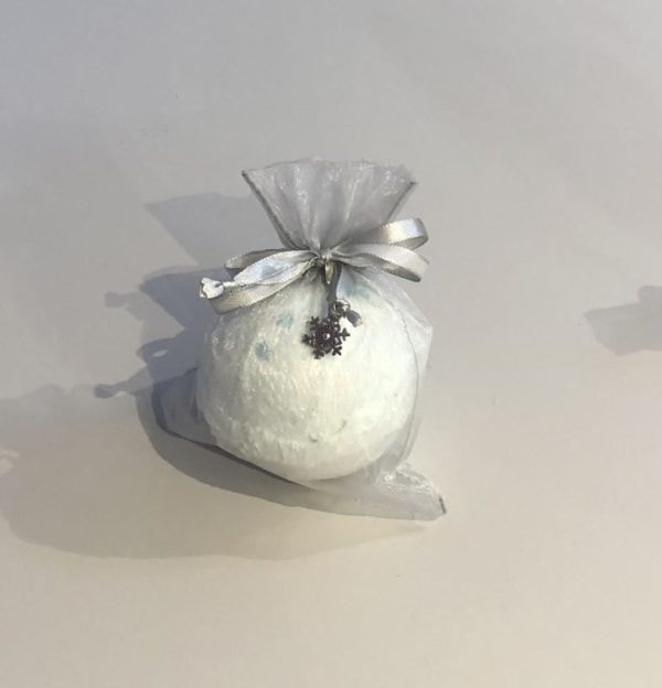 snowflake bath bomb with a festive charm gift bag